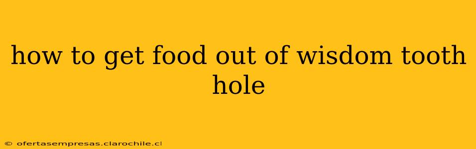 how to get food out of wisdom tooth hole