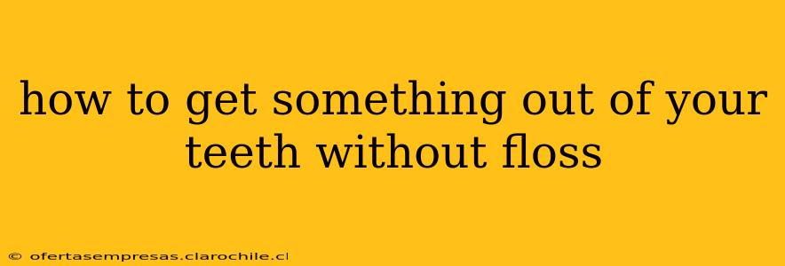 how to get something out of your teeth without floss
